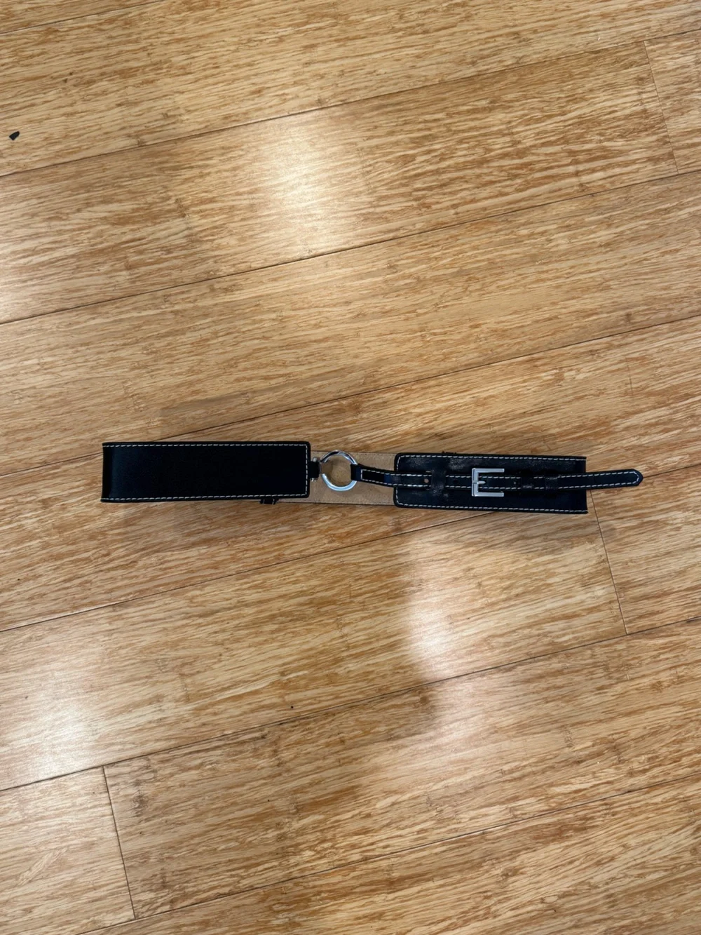 Black leather belt with silver ring buckle